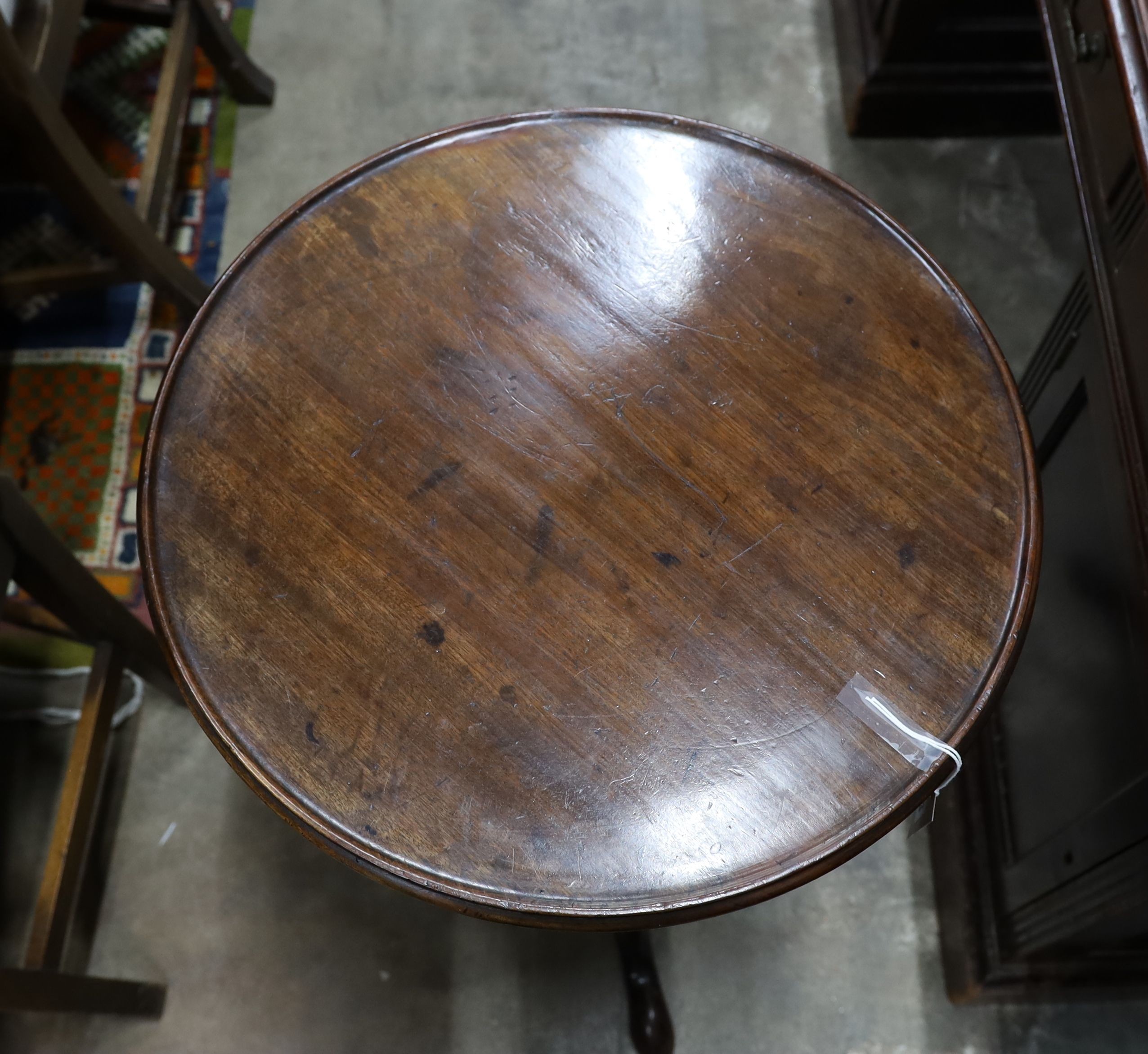 A George III mahogany circular tilt top tripod table, diameter 50cm, height 70cm